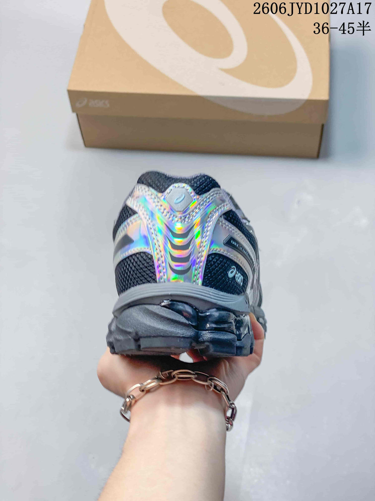 Rear view of a dark gray sneaker with iridescent heel accents