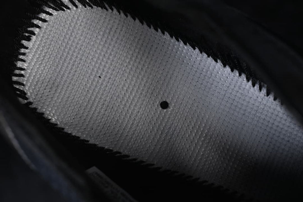 Close-up of the shoe's interior lining and textile panel