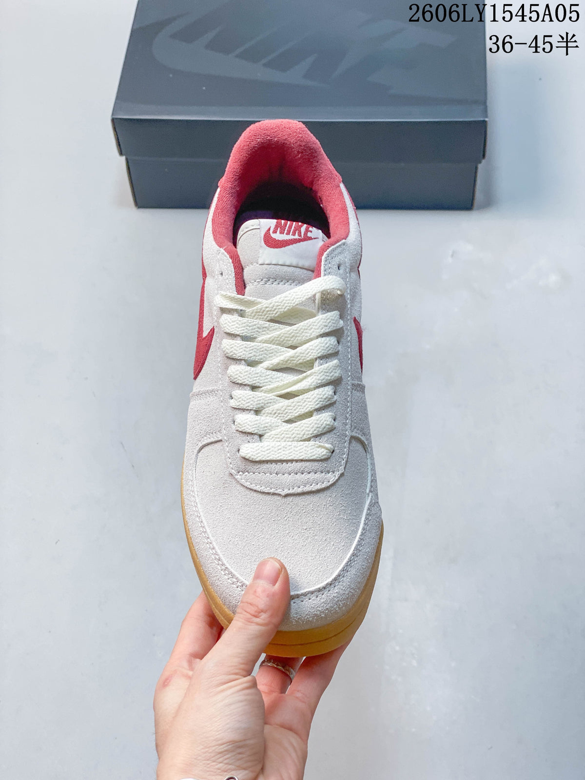 Top view showing the white laces and red collar lining