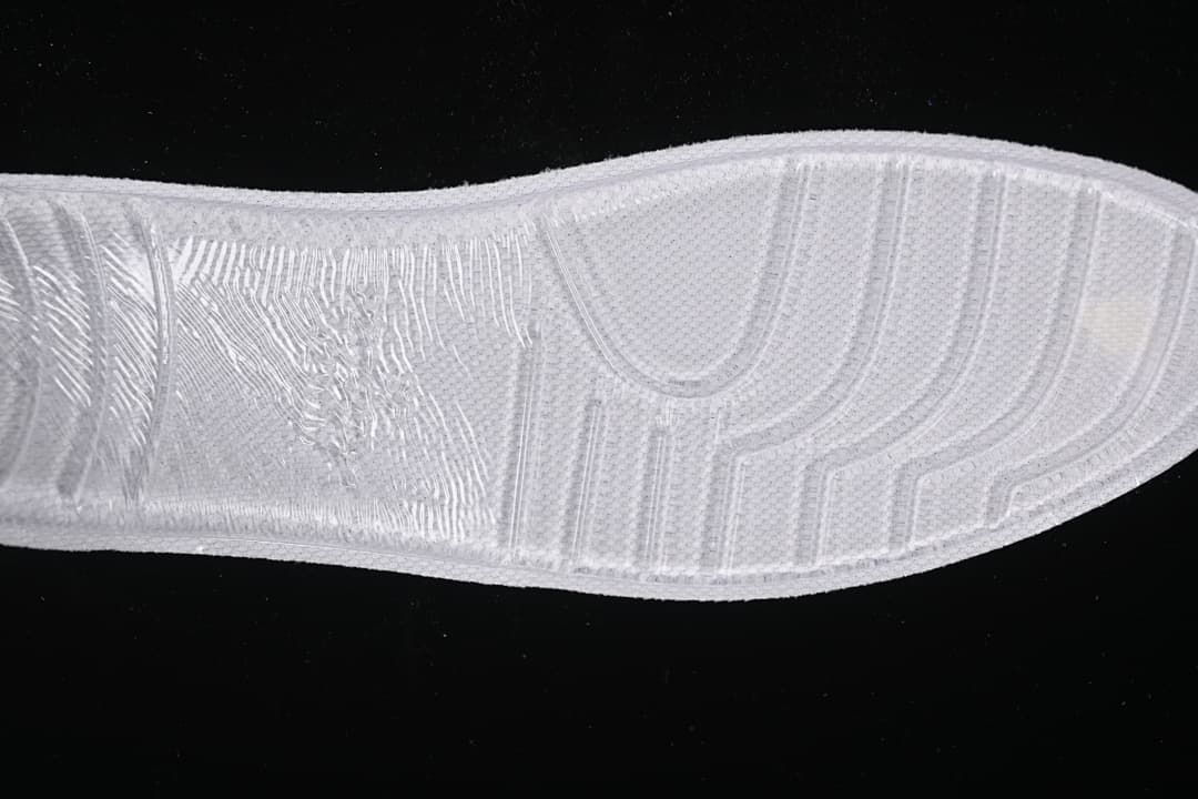 Close-up of the white sneaker outsole tread