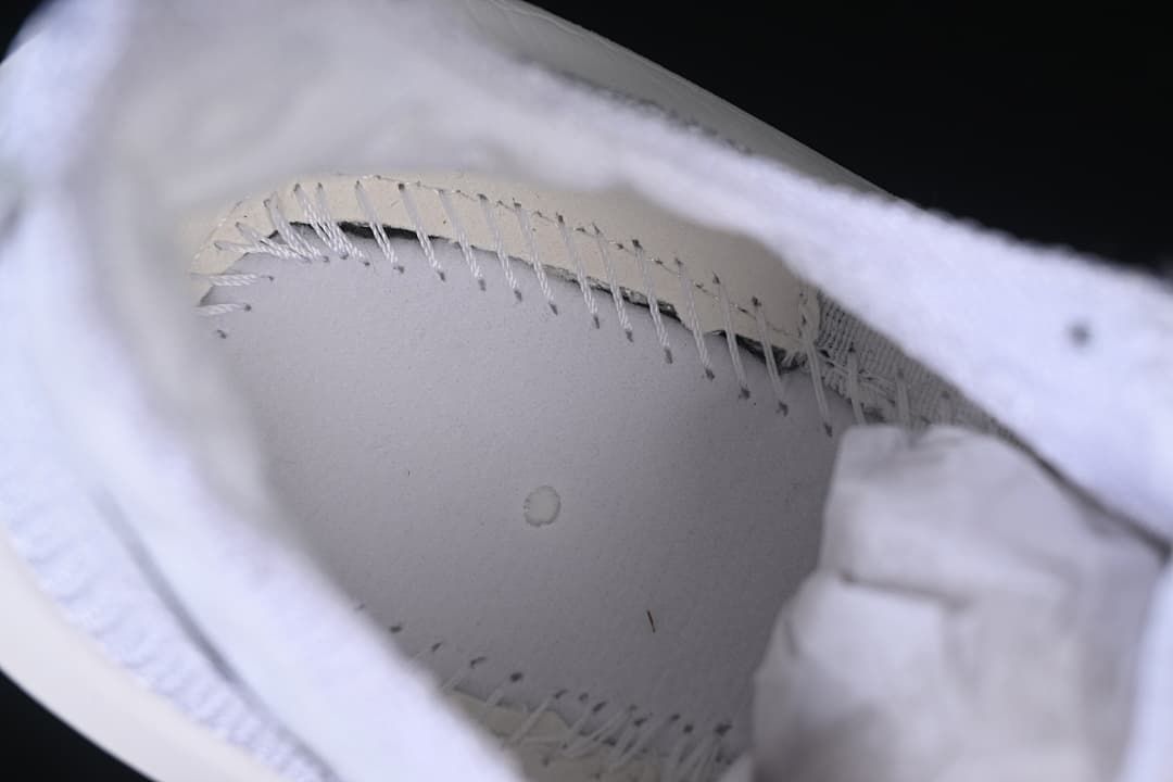 Close-up inside the shoe showing interior construction and stitching