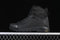 Side view of a black The North Face Verto Alpine Mid boot with a GORE-TEX marking and lugged sole.