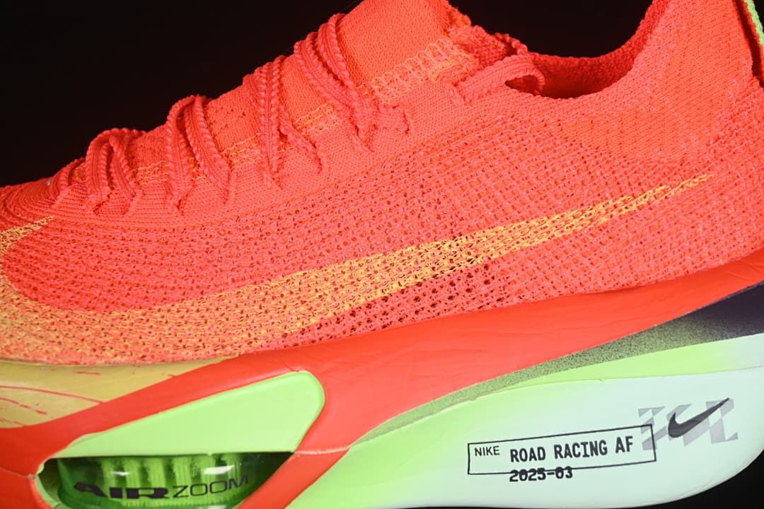 Close-up of the knit-look upper, yellow Swoosh, and midsole details