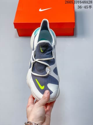 Top view of a Nike Free RN 5.0 shoe with navy, white, teal, and lime details