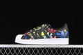 Side view of a black adidas Superstar with colorful graphics, shell toe, and white sole
