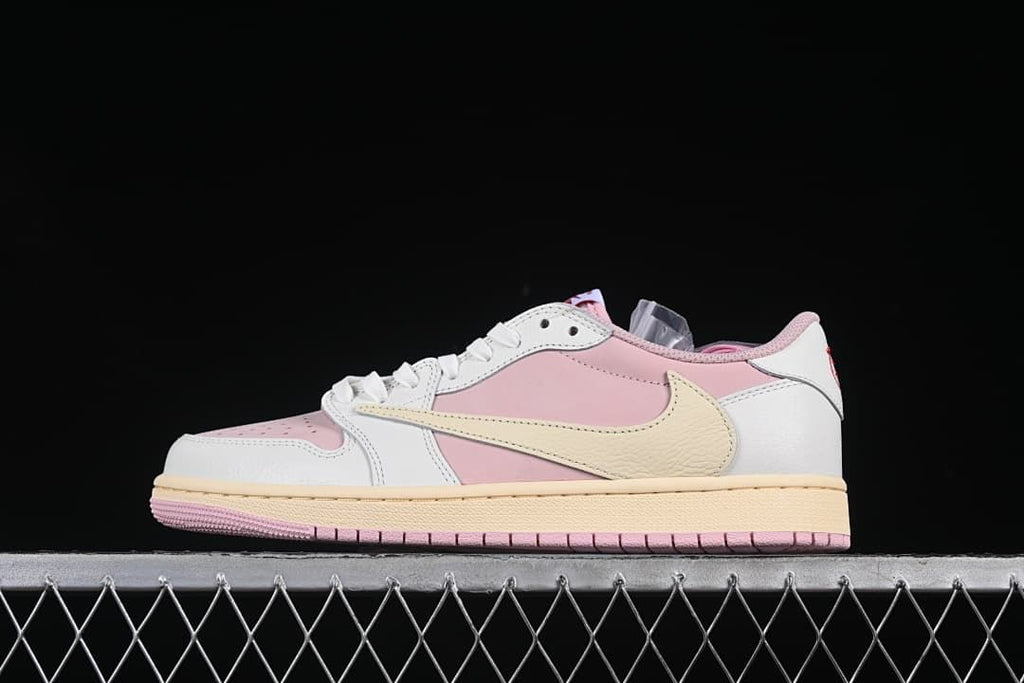 Side profile of pink, white, and sail low-top Jordan 1 sneakers