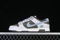 Side view of a gray, white, and pale blue Nike SB Dunk Low sneaker with a pigeon graphic on the heel
