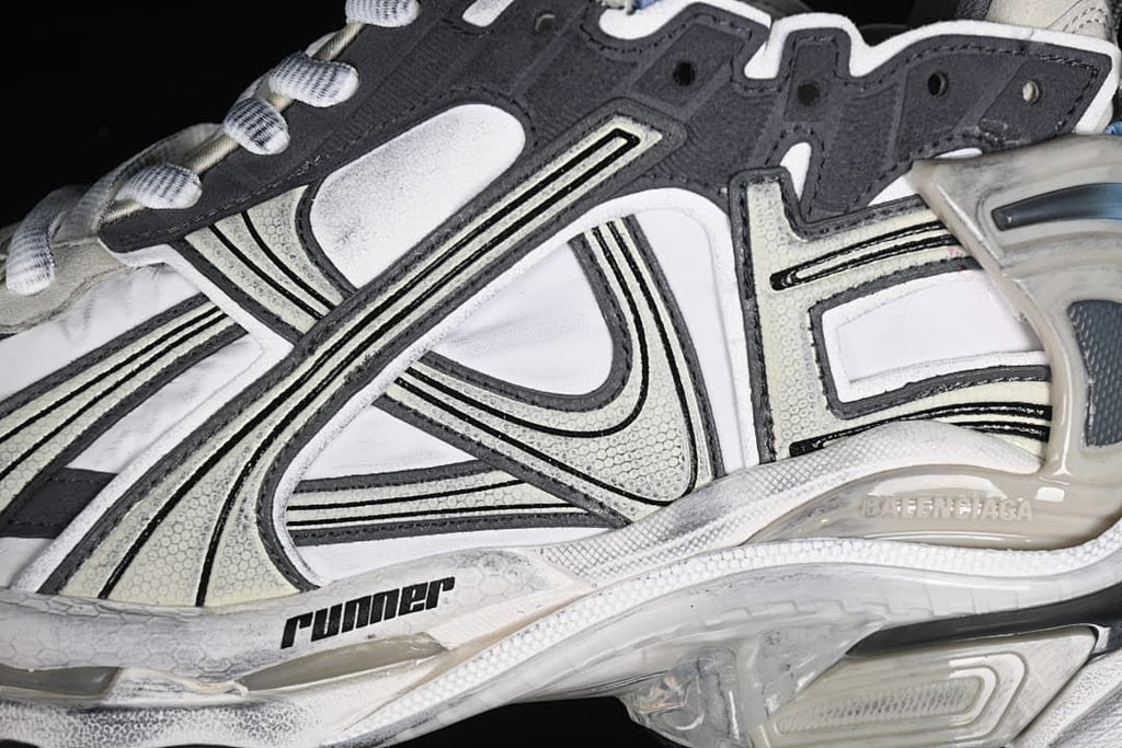 Close-up of the side overlays, stitching and Runner branding.
