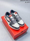 Pair of off-white and dark patterned low-top sneakers with red accents displayed on a red box