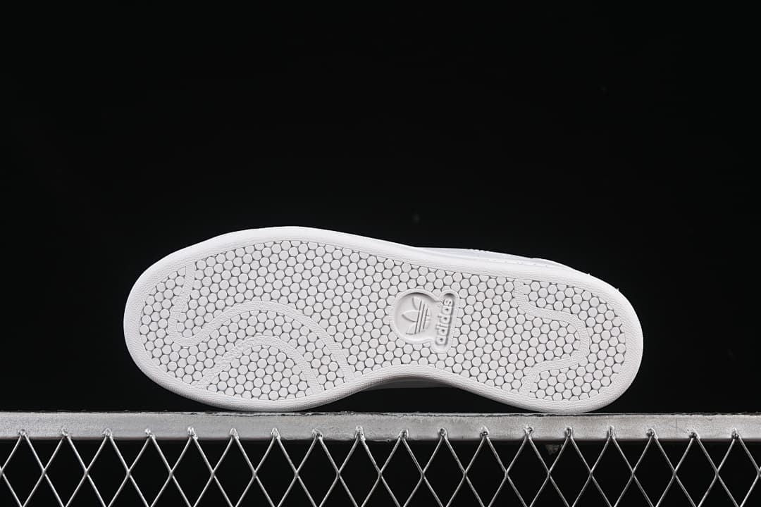 Underside showing the patterned white outsole