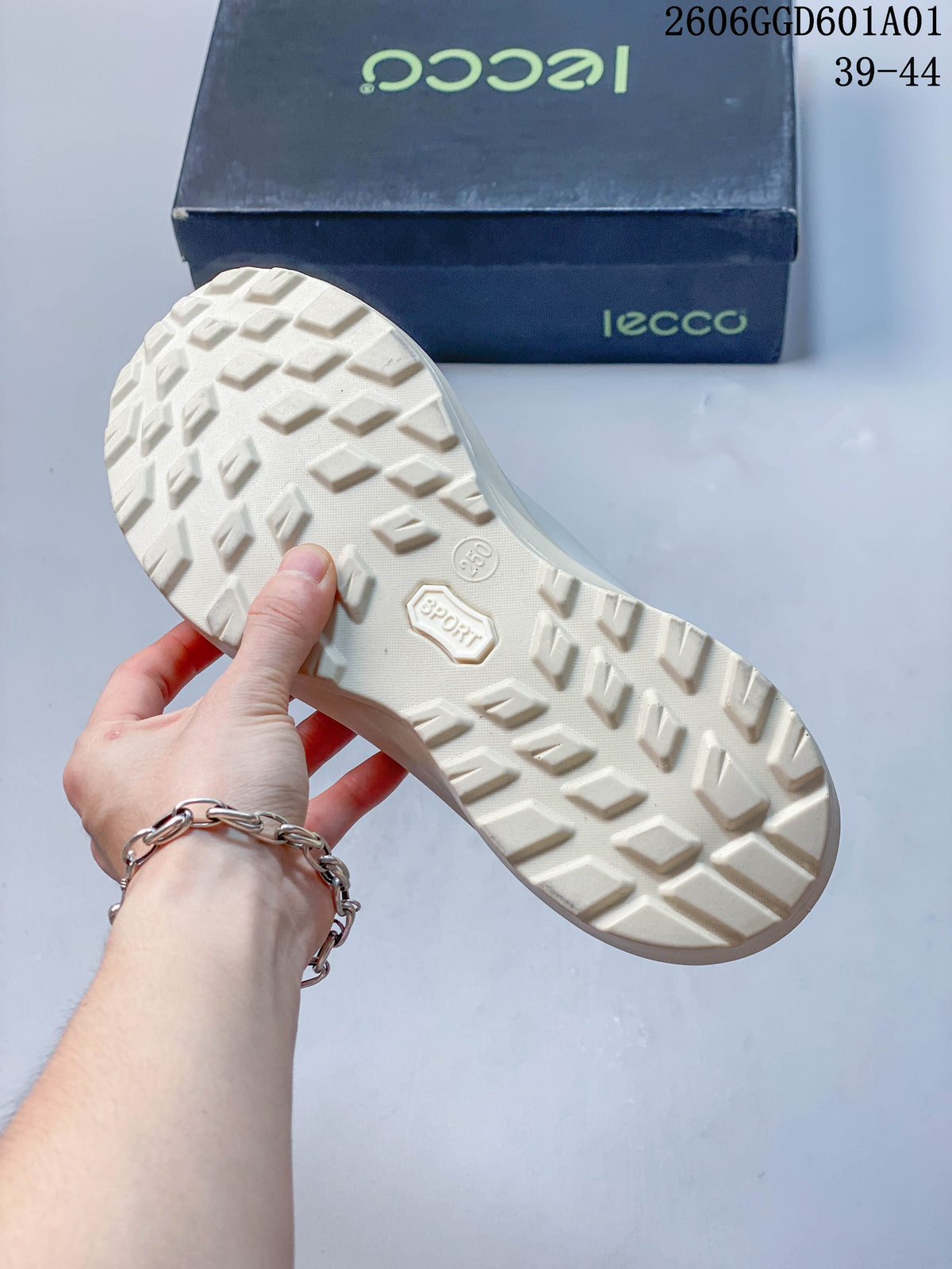 Underside of the sneaker showing its patterned off-white tread