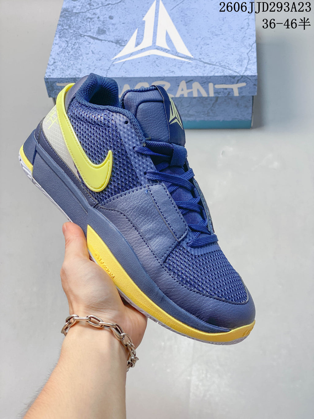 Blue Nike Ja 1 EP shoe with yellow accents.