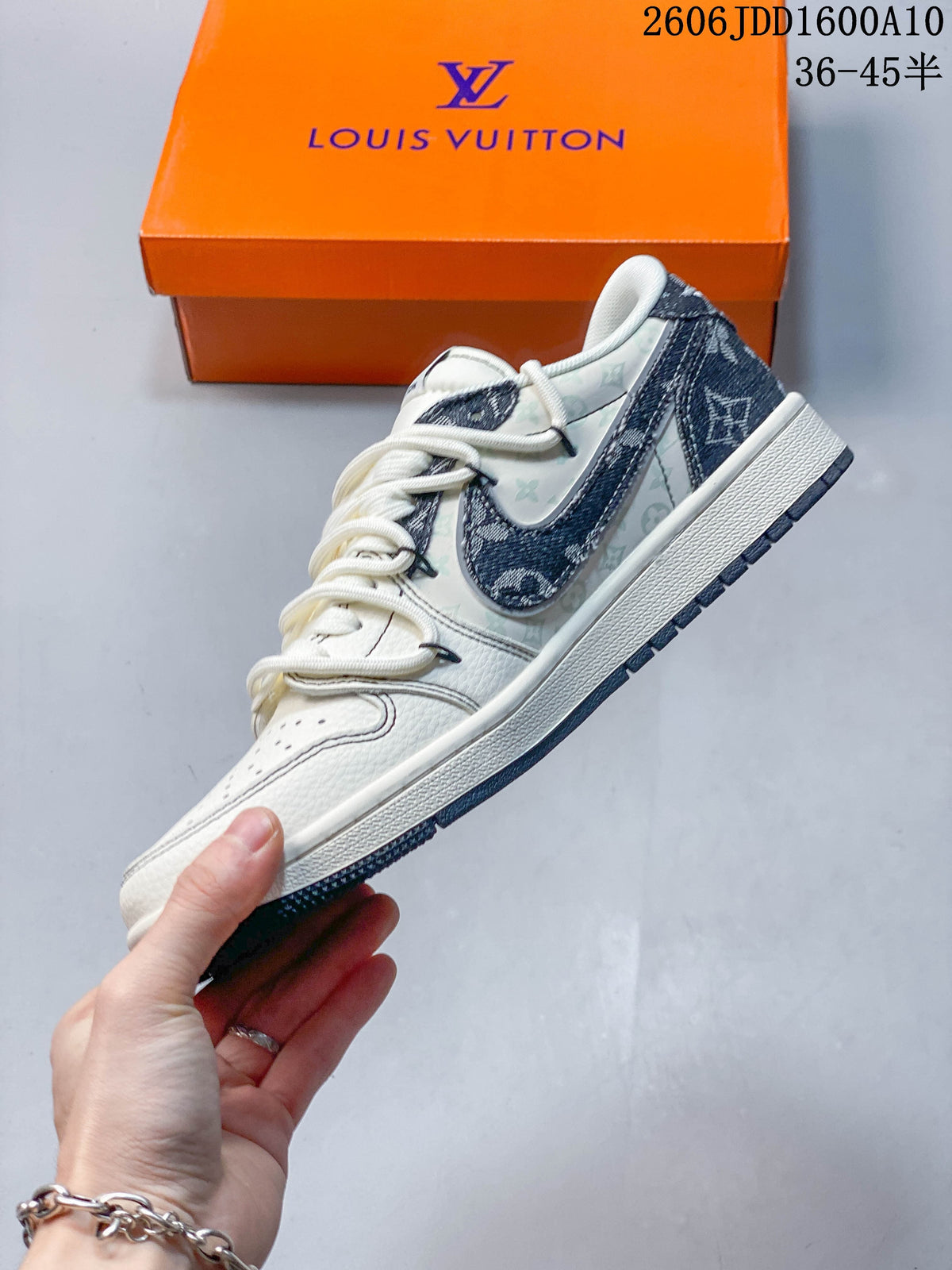 Side view of the low-top sneaker with a large dark swoosh and patterned overlays