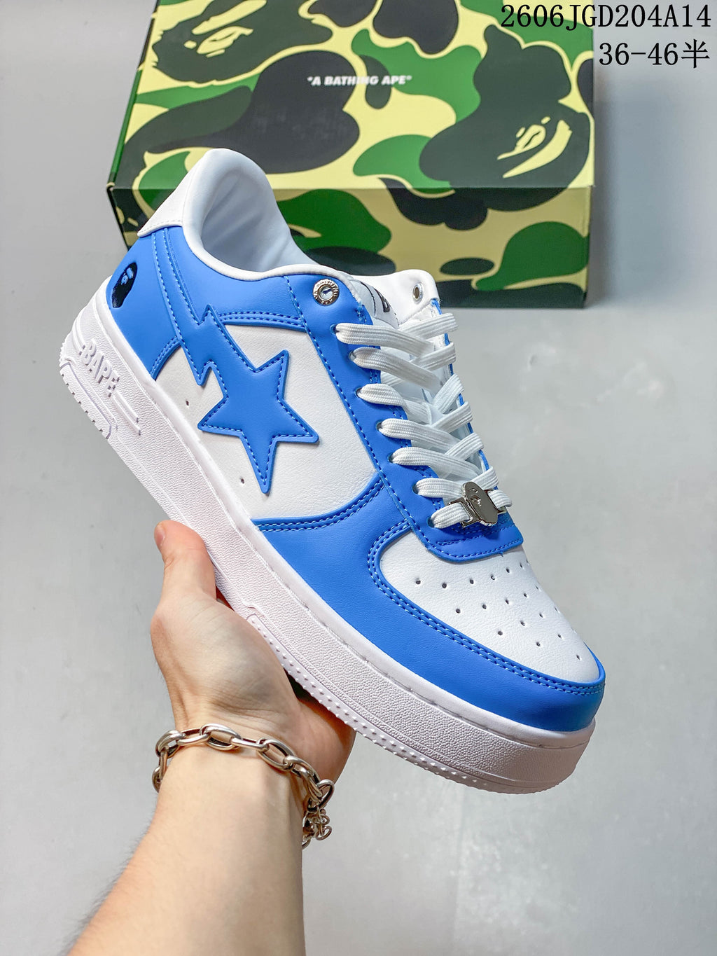 Angled side view of the blue and white BAPE STA low-top sneaker
