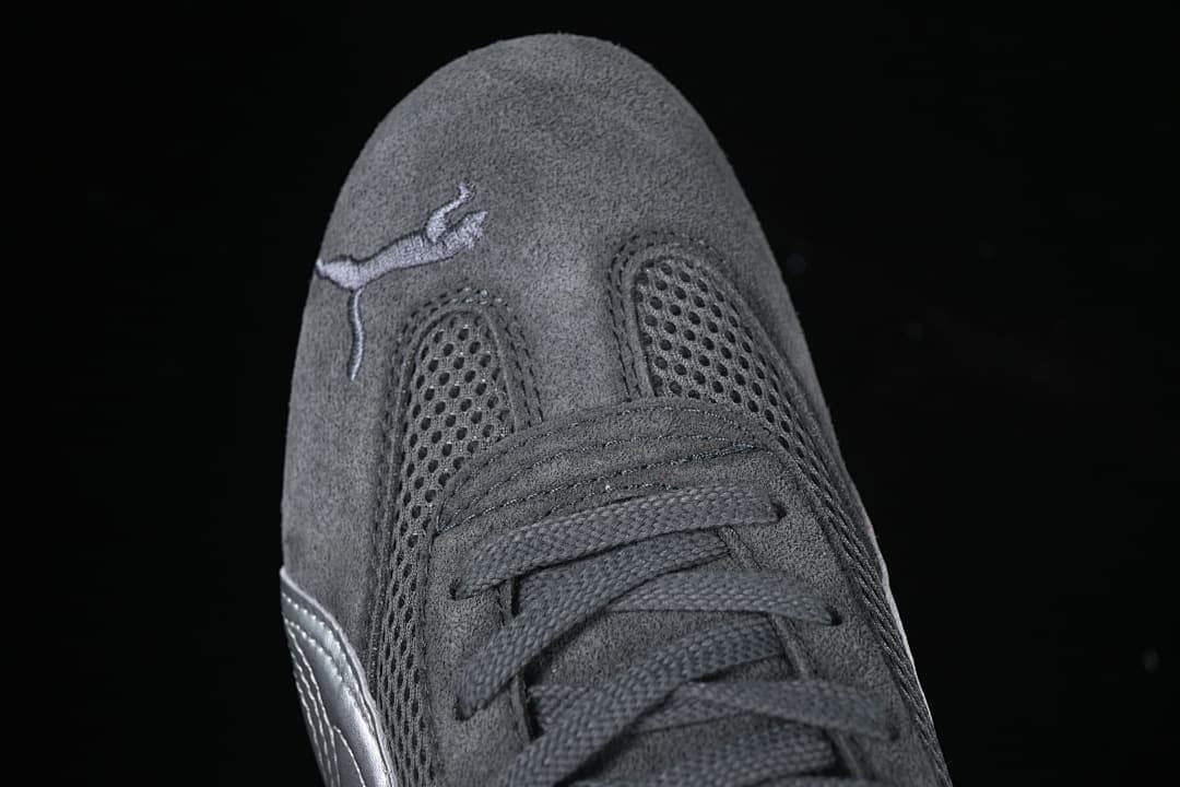 Top-down close-up of laces, mesh panels, and Puma logo