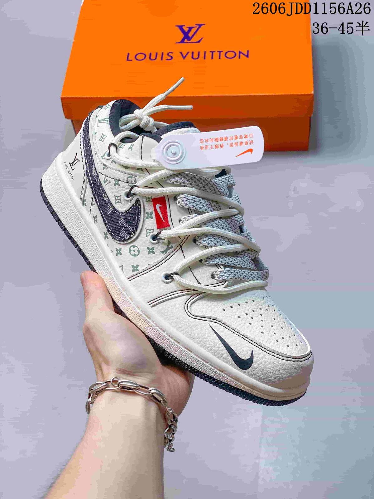 Side view of a white low-top sneaker with patterned panels, dark swoosh-shaped detail and contrast laces.