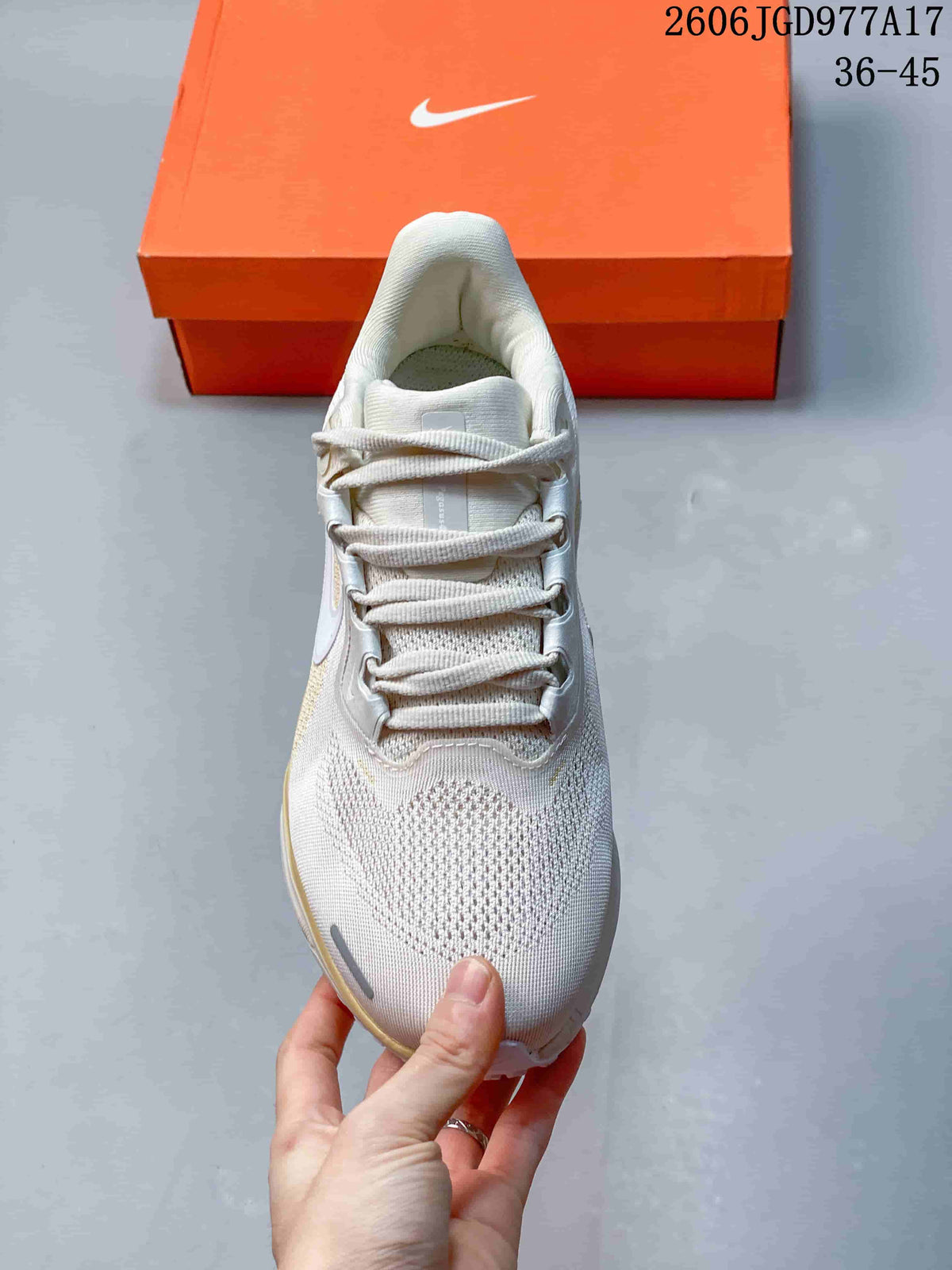 Top view of an off-white Nike Air Zoom Pegasus 41 shoe showing its laces and textured toe area.