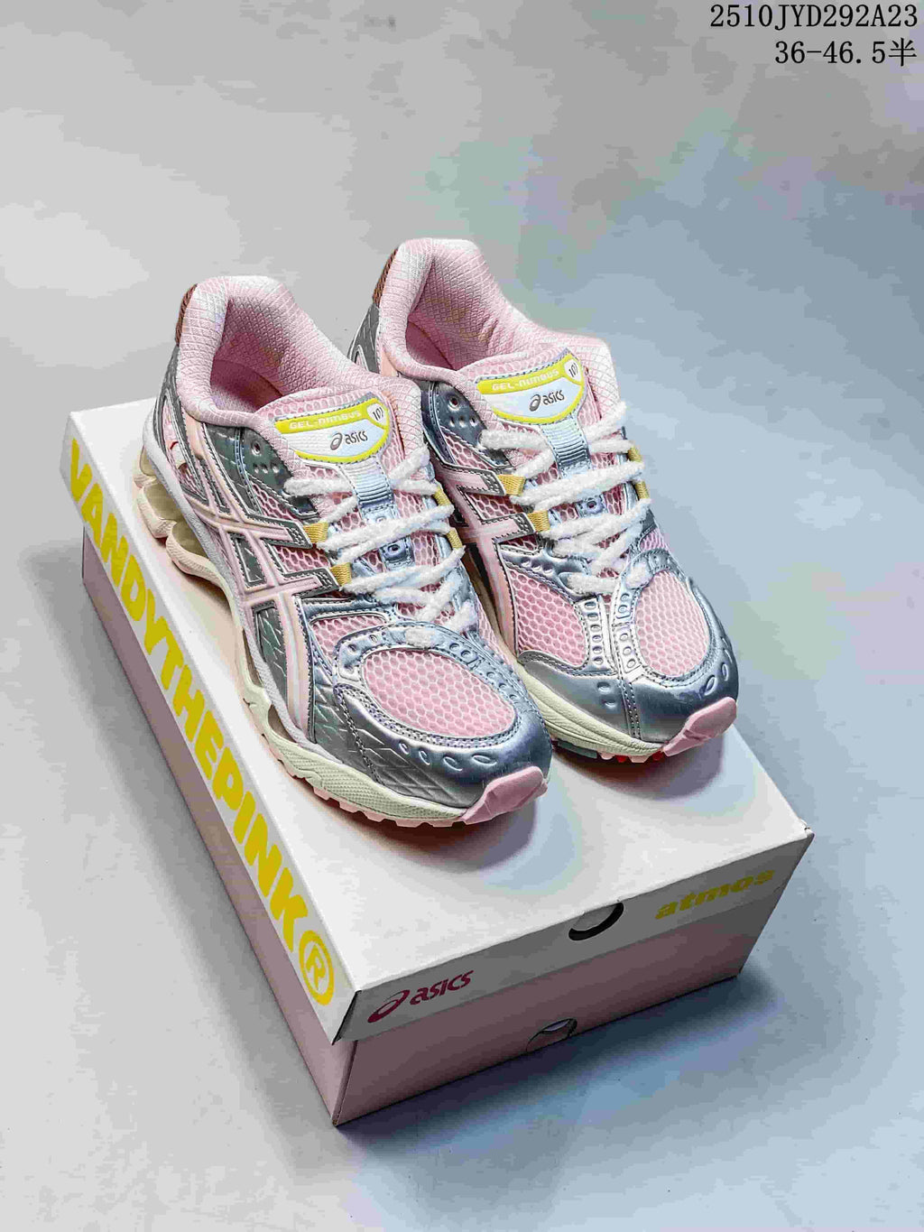 Pair of pink and silver ASICS GEL-Nimbus 10.1 sneakers on a shoe box