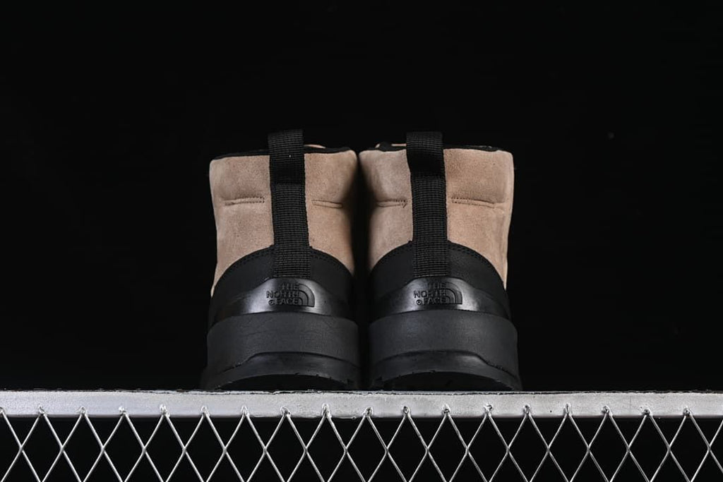 Rear view of the pair showing heel pull tabs and branding