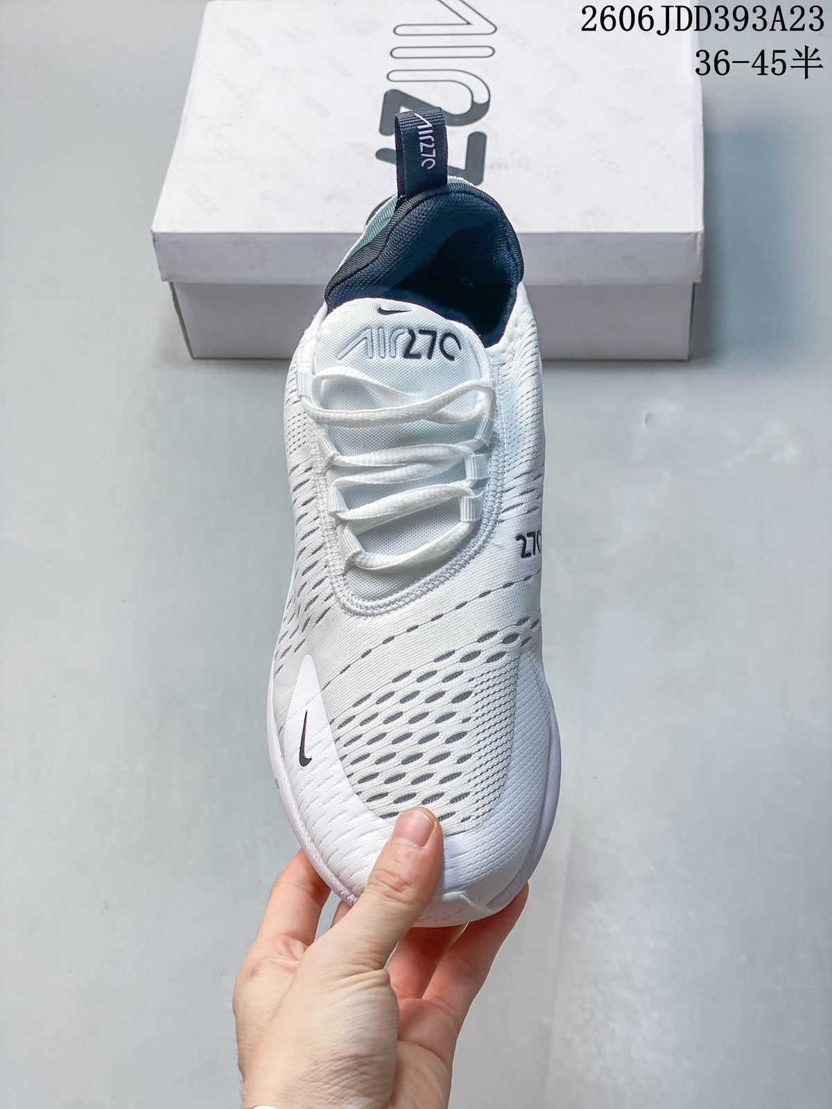 Top view of a white Nike Air Max 270 sneaker showing laces and perforated details