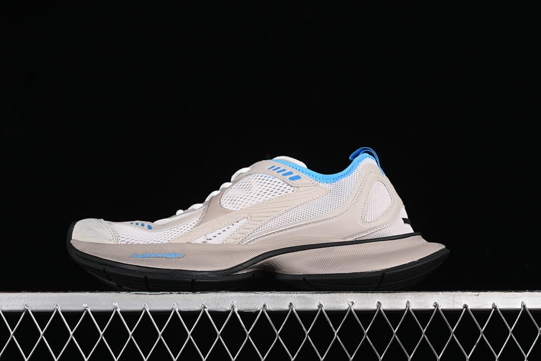 Side profile of a single sneaker against a dark background