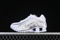 Side profile of a white and metallic silver Nike Shox R4 sneaker
