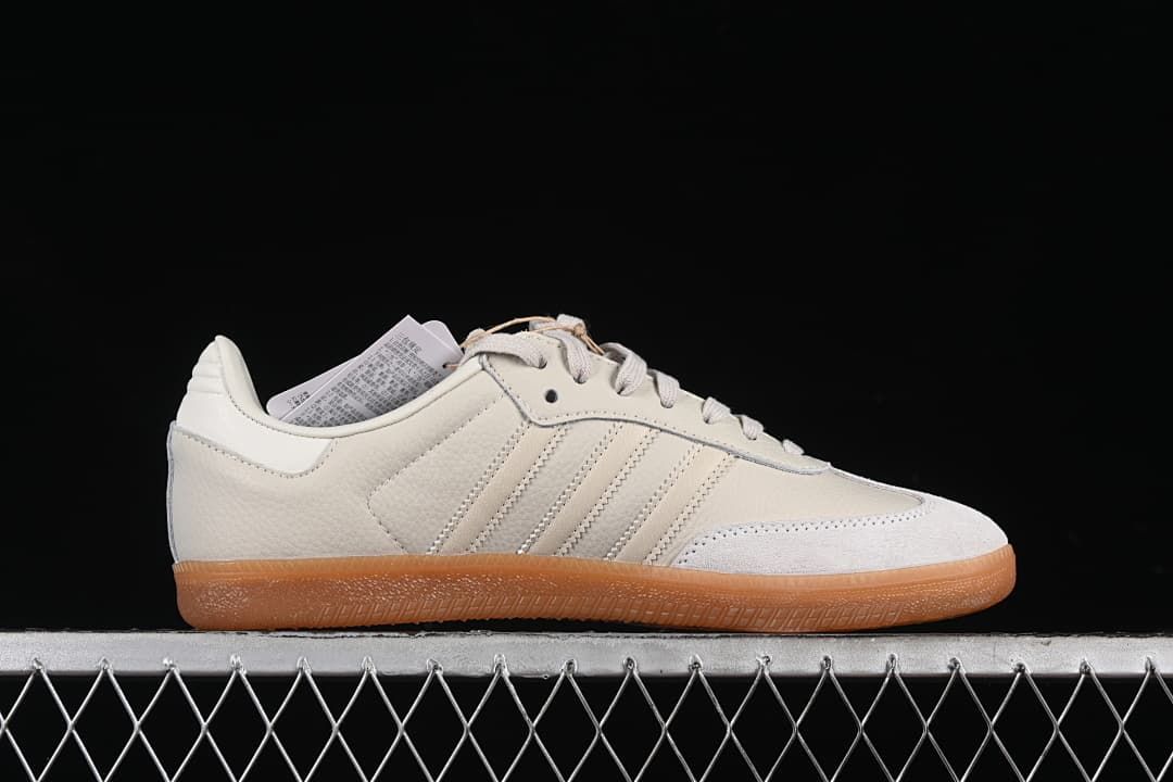 Side profile of the off-white sneaker with three stripes and gum outsole
