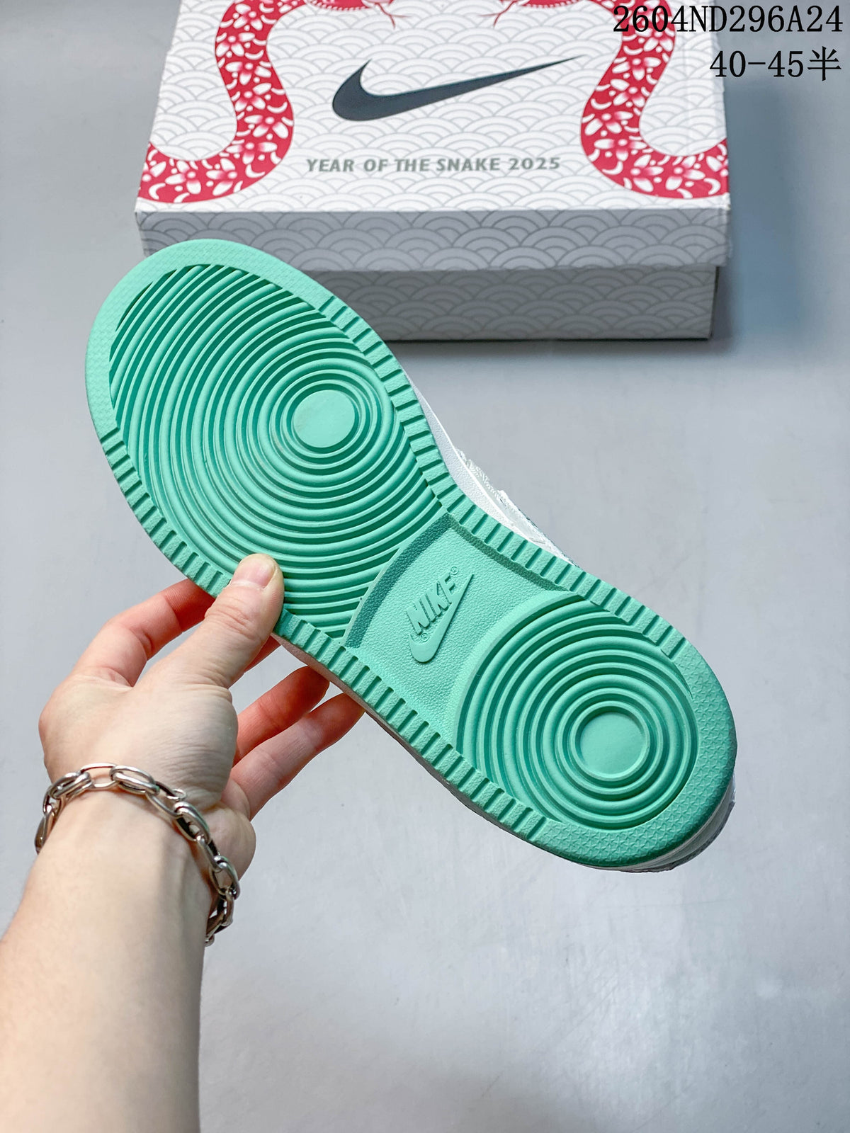 Mint-green outsole of the Nike Court Vision Low beside a Year of the Snake 2025 shoe box