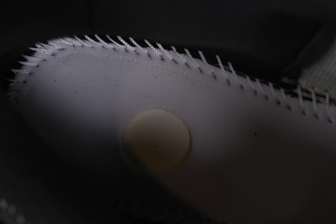Close-up detail of stitching on the shoe upper.