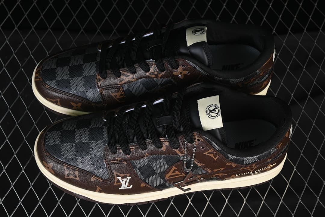 Top view of a pair of brown and grey patterned low-top sneakers with black laces