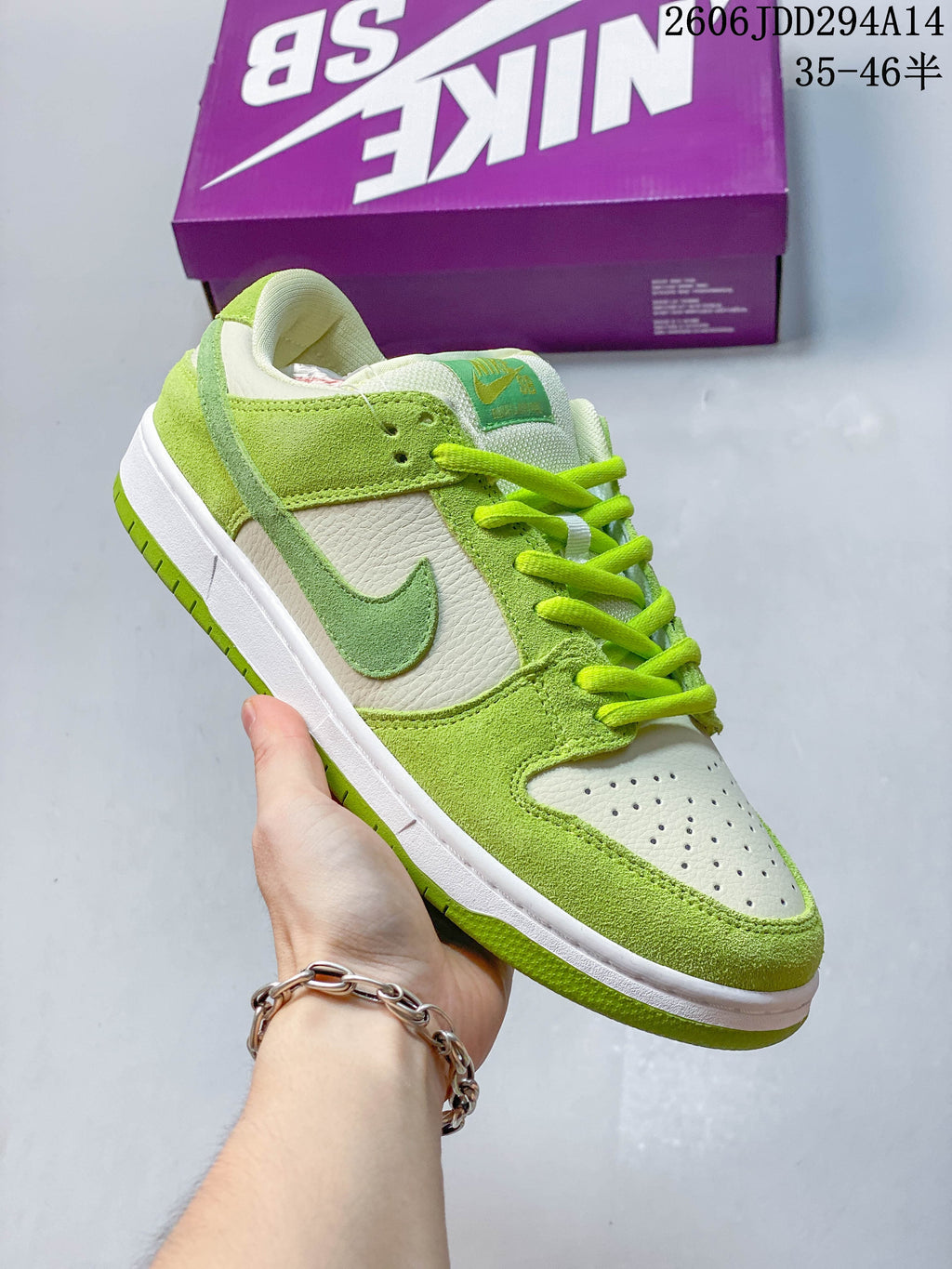 Close side view of the lime-green and white Nike Dunk Low SB sneaker