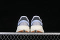 Rear view of the light blue and gray adidas Lightblaze sneakers