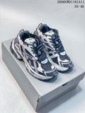 Pair of white, navy, and gray Balenciaga Runner Gradient sneakers shown from the front on a box