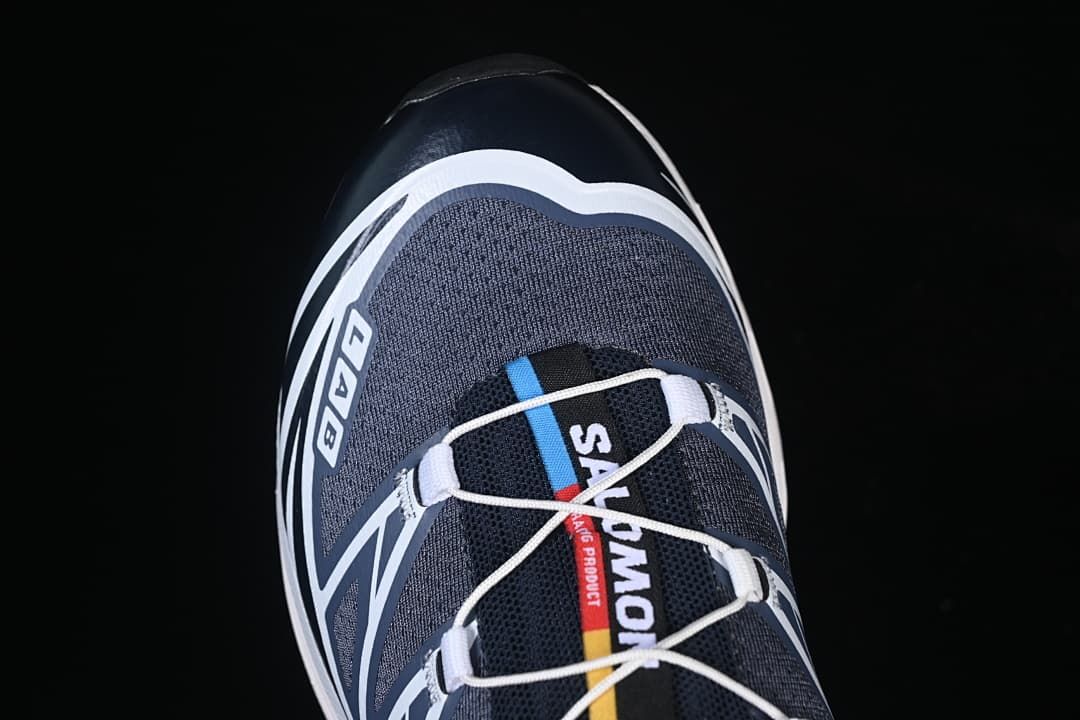 Top view of the navy and gray shoe with white laces