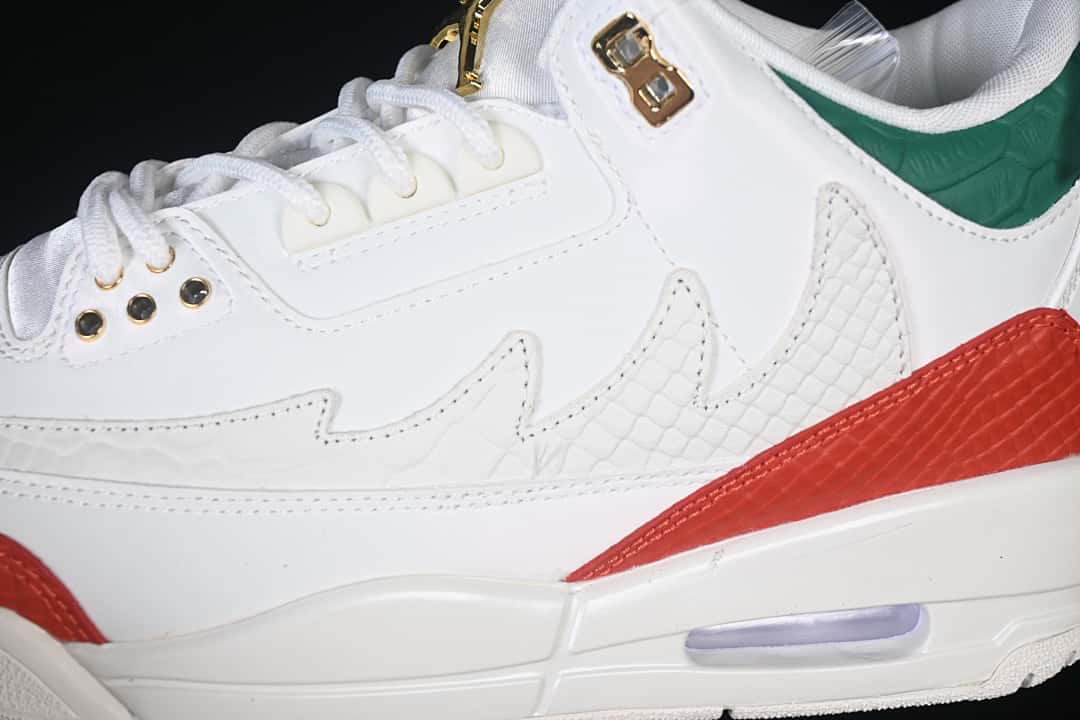 Close-up of the side panels, patterned overlays, red accent panel, and midsole cushioning window