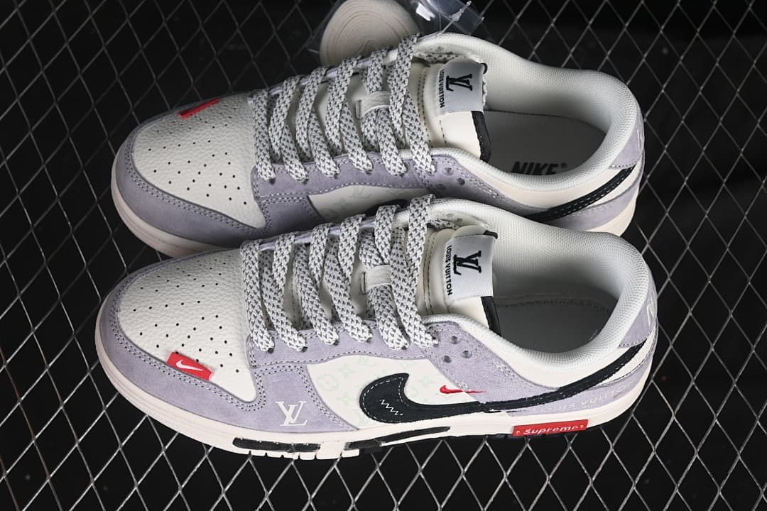 Overhead view of a pair of white and lavender low-top sneakers with patterned panels and contrasting laces.