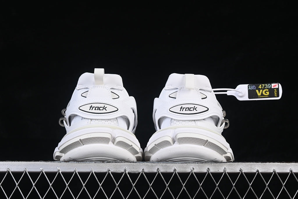 Rear view of both sneakers showing the heel straps and chunky soles.