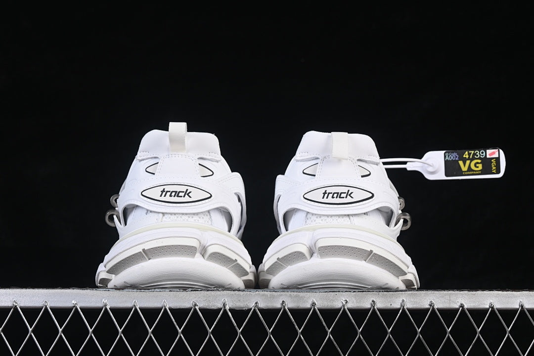 Rear view of both sneakers showing the heel straps and chunky soles.