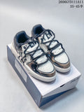 Pair of white and navy MLB Chunky Liner low-top sneakers with metallic-look panels, shown on a shoe box.