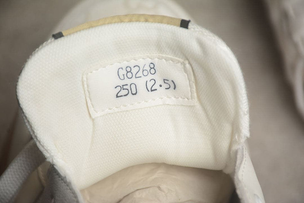 Sneaker tongue label marked 250 (2.5), showing the photographed sample sizing