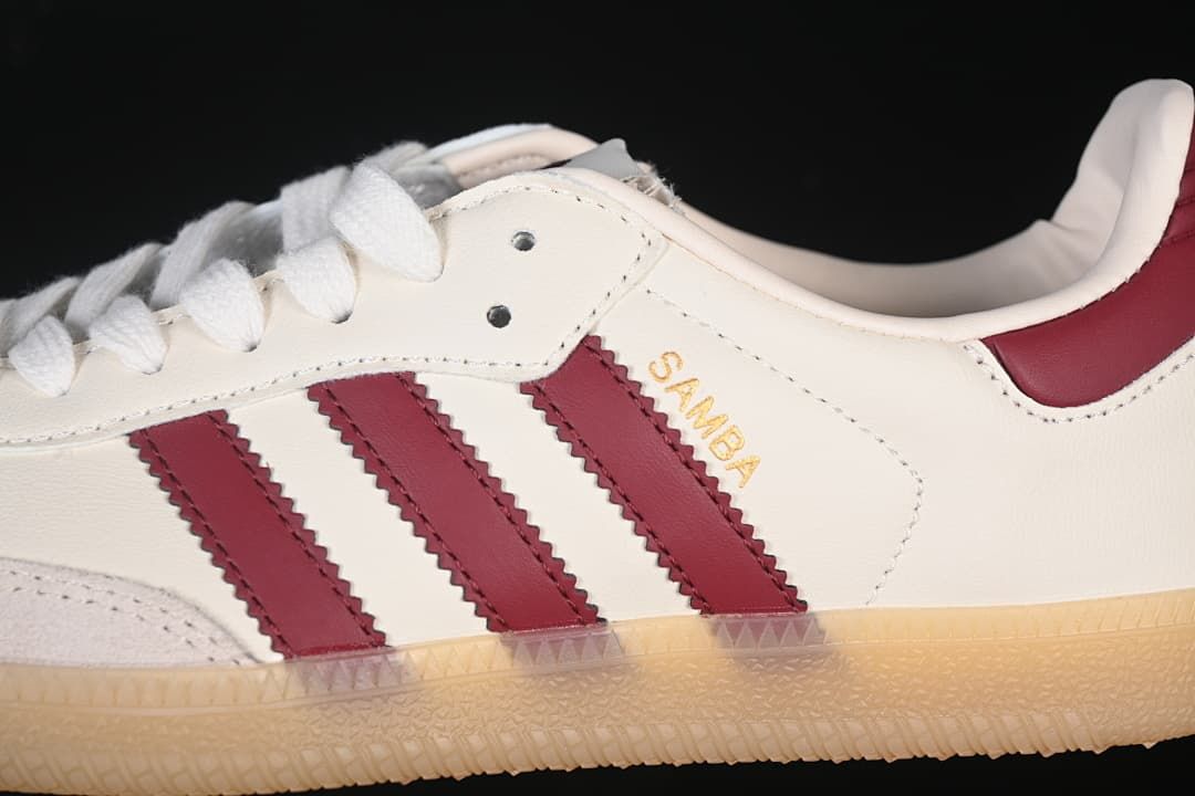 Close-up of the burgundy side stripes, cream upper, and Samba lettering.