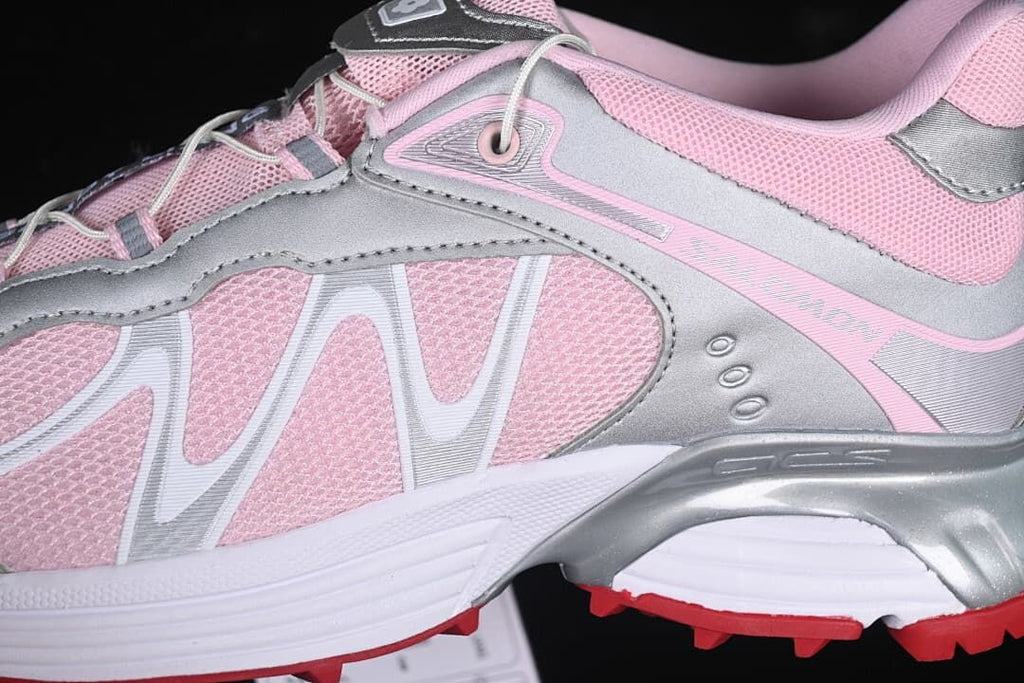 Close-up of pink mesh-look upper, silver-tone overlays and side branding