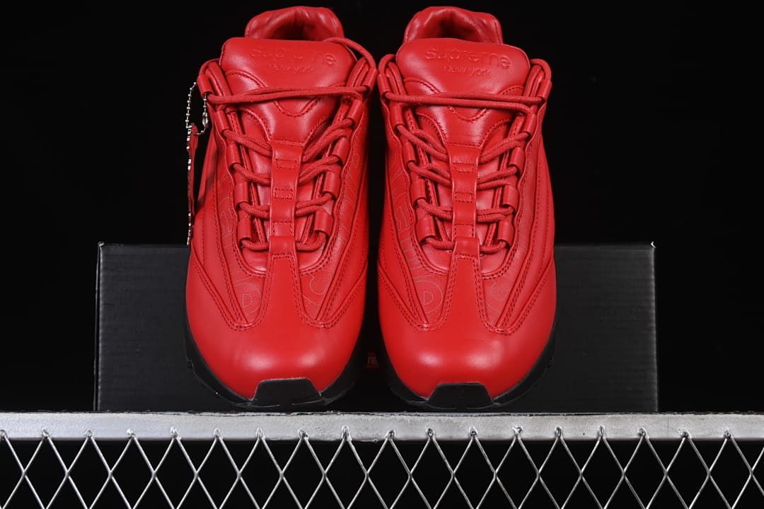 Front view of the pair showing red uppers and lace details