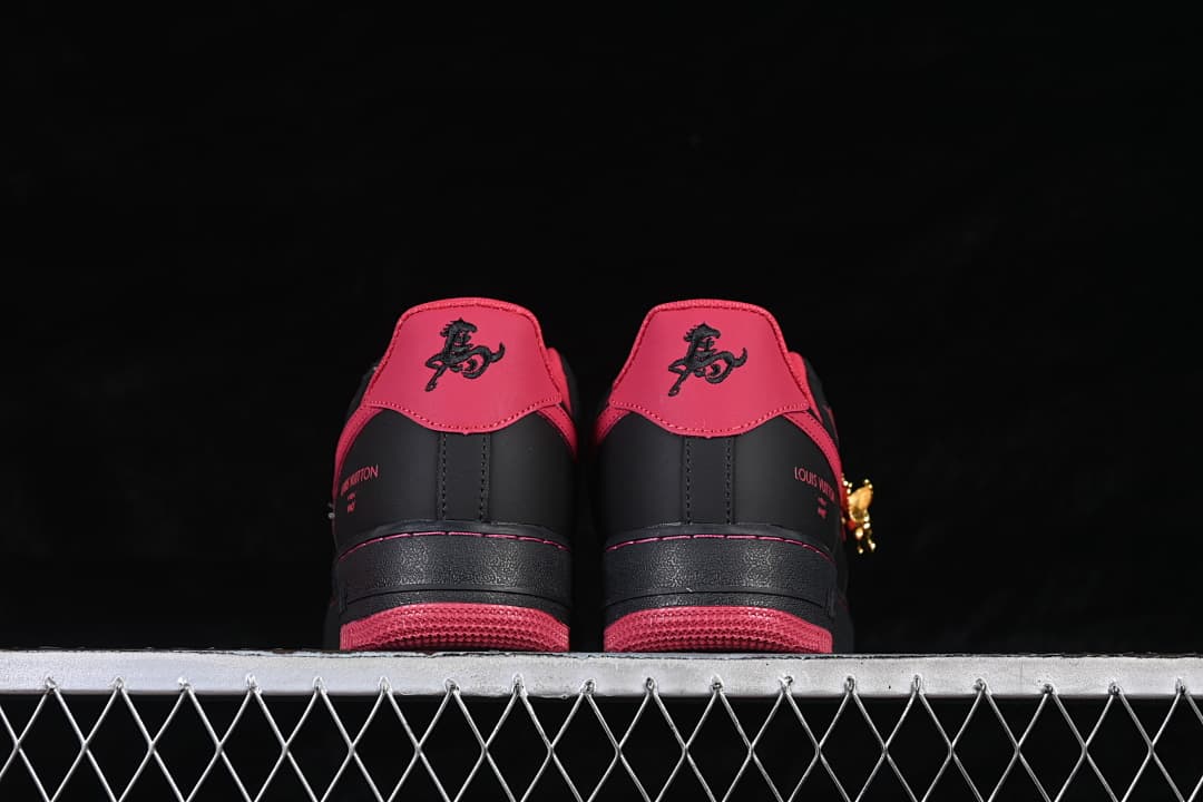 Rear view of both sneakers showing red heel tabs and red outsoles