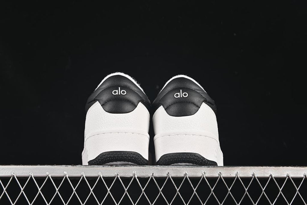 Rear view of the pair showing contrasting heel panels and logos