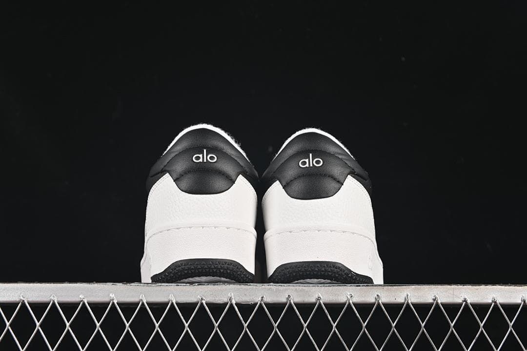 Rear view of the pair showing contrasting heel panels and logos