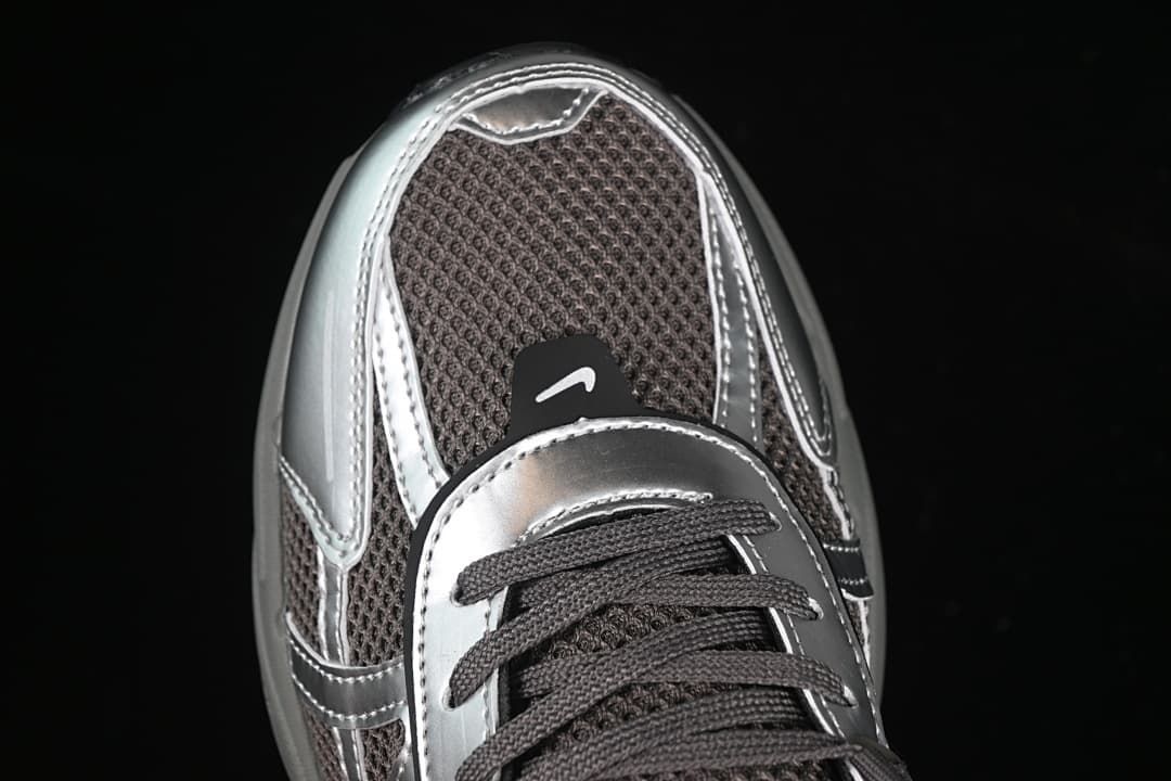 Top-down close-up of the toe, mesh panels, and metallic-look overlays