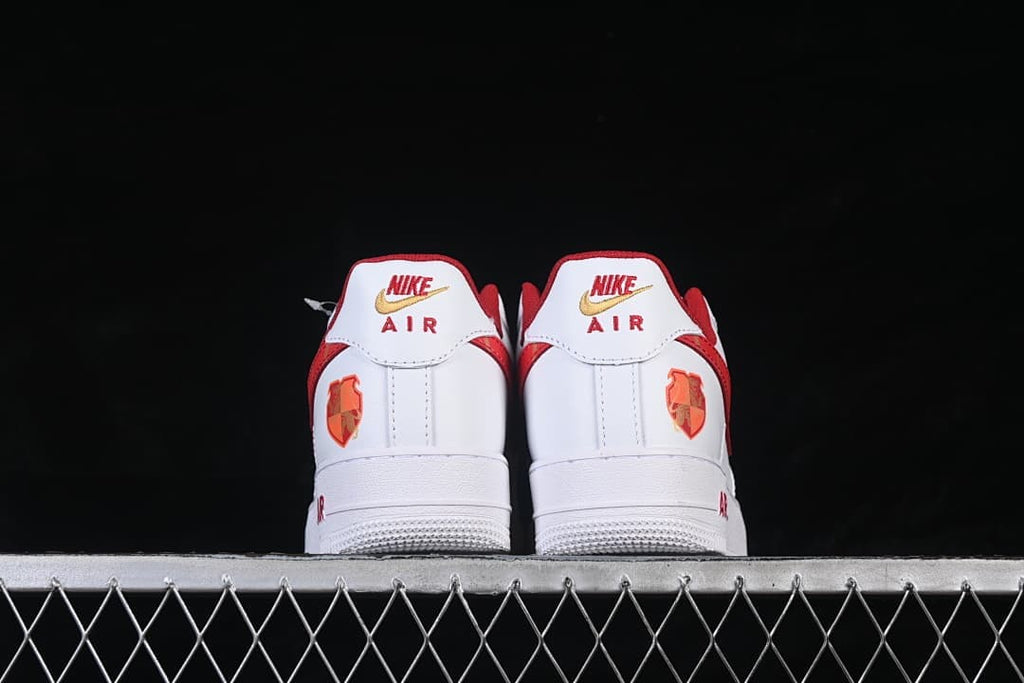 Rear view of the pair showing Nike Air heel branding and decorative heel graphics.