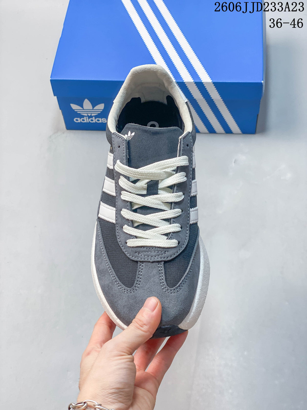 Top view of the gray sneaker showing its laces and toe design