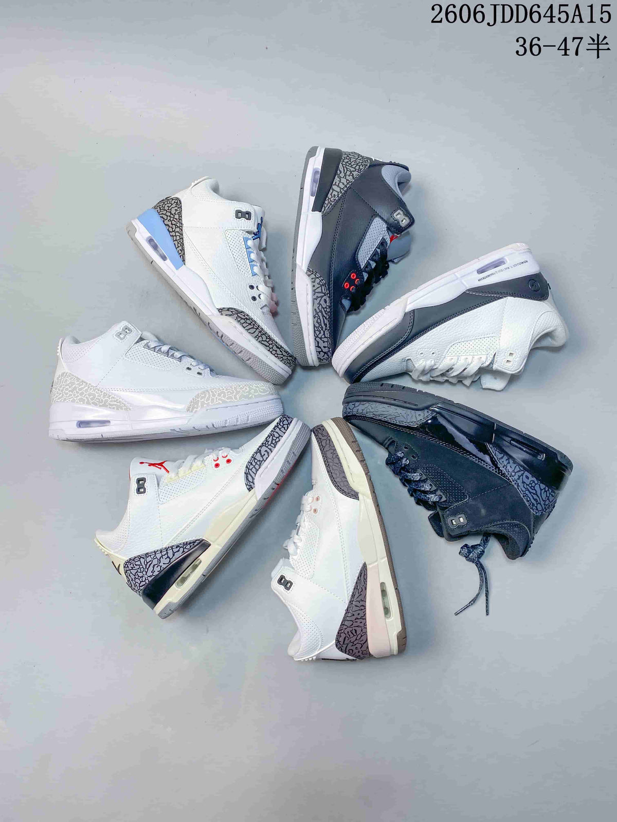 Several white and gray low-top Jordan sneakers arranged in a circle, showing different color combinations.